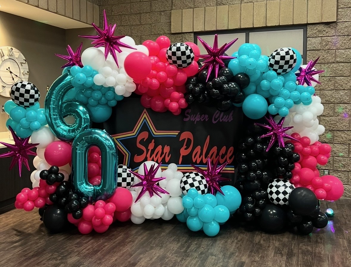 Star Palace, 60th birthday — magenta, teal, and black checkered backdrop with starbursts